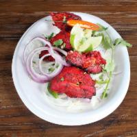 Chicken Tandoor · Roasted grilled leg quarters marinated in yogurt and spices. Served with Yellow Rice and 1 B...