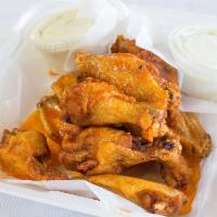 12 Chicken Wings · Cooked wing of a chicken coated in sauce or seasoning. Choice of sauce. Extra dipping sauce ...