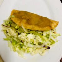 Potato Hard Taco · Fried corn tortilla served with seasoned mashed potatoes, lettuce & cheese.