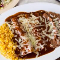 Two Cheese Enchiladas Combination Dinner · Corn tortillas stuffed with cheese and topped with enchilada sauce.