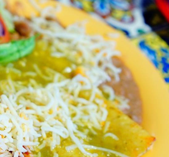 Green Enchiladas · 4 green cheese enchiladas with rice, beans and salad.