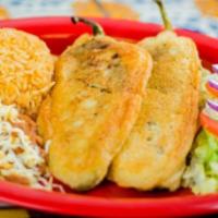 Chiles Rellenos · 2 stuffed chiles rellenos with cheese served with rice, beans and salad.