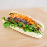 12. Pork Belly Banh Mi · Tender thick-cut pork belly, seared to order, sweet chili sauce, shallots.