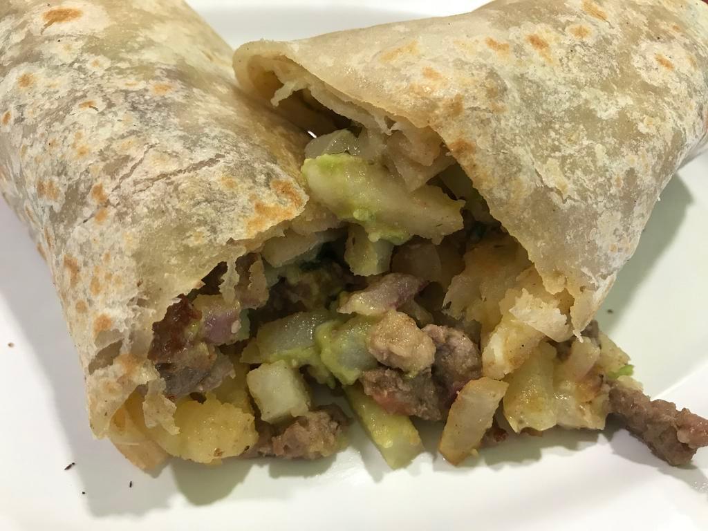 Pueblito Burrito · Carne asada, cooked pico de gallo, potato and cheese.