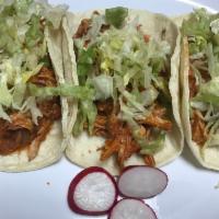 Red mole Chicken Taco · Shredded chicken and onions cooked on a red mole sauce, lettuce.