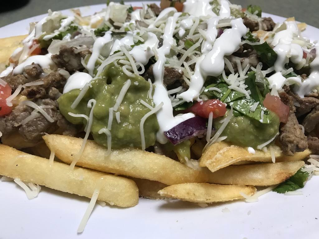 Pueblito Fries · French fries, cheese, meat, pico de gallo, and sour cream.