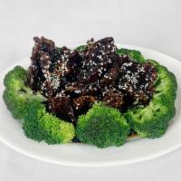 Crispy Sesame Beef · 芝麻牛 — Crispy fried beef, in a dark sauce, sprinkled with sesame seeds. Served with broccoli. 