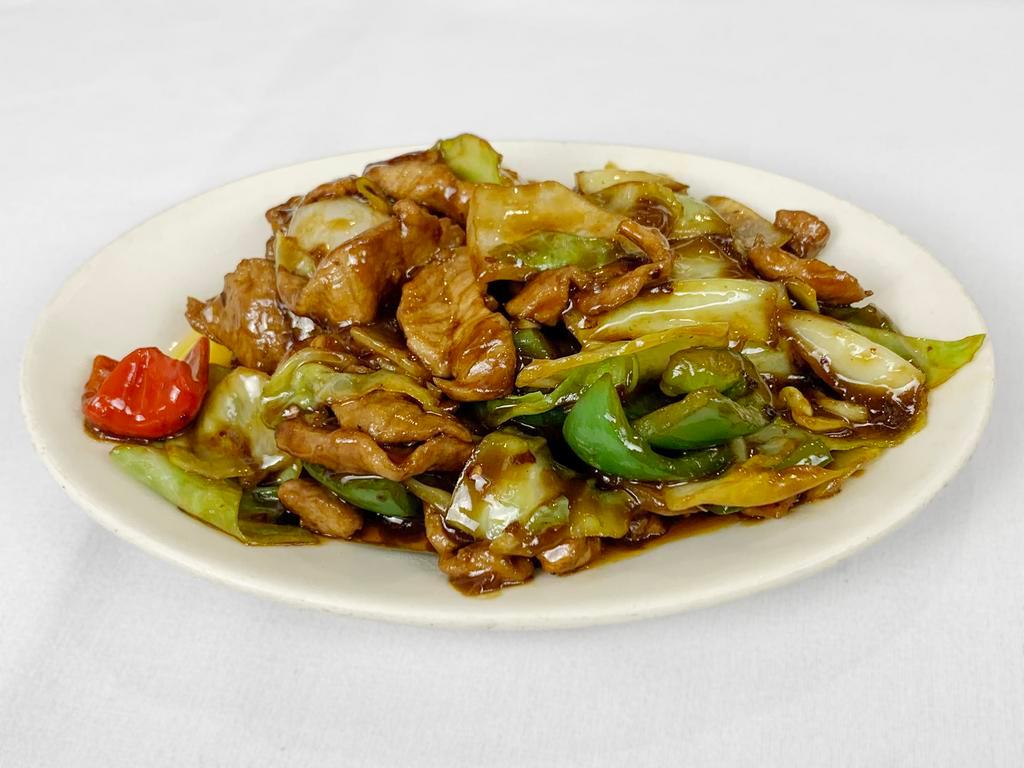 Twice-Cooked Pork · 回鍋肉 — It really is cooked twice! In this Sichuan dish, the pork is first simmered with spices, then wok-fried with cabbage, bell peppers, and sauce. Give it a try! 