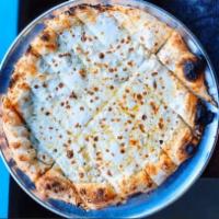 Extra Large Cheesy Bread · House wood-fired pizza dough topped with mozzarella cheese and baked to melty perfection.  S...