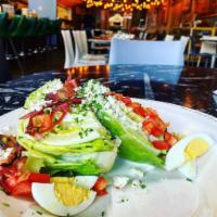 Wedge Salad · Iceberg lettuce wedge topped with hard boiled egg, tomato, pickled red onion, cherry smoked ...