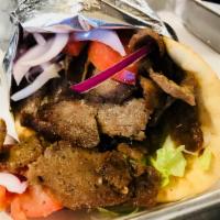 Gyro Pita · Seasoned ground lamb and beef slowly sizzled on the rotisserie lettuce, tomato, and onions w...