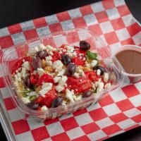 Quinoa Power Salad · Arugula, Quinoa, Feta, Roasted Peppers, Chickpeas, Olives, Balsamic Dressing