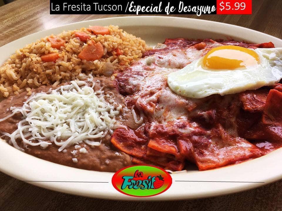 Breakfast Huevos Rancheros · Eggs over easy topped with house made ranchero sauce on a freshly made tostada with side of rice and beans.