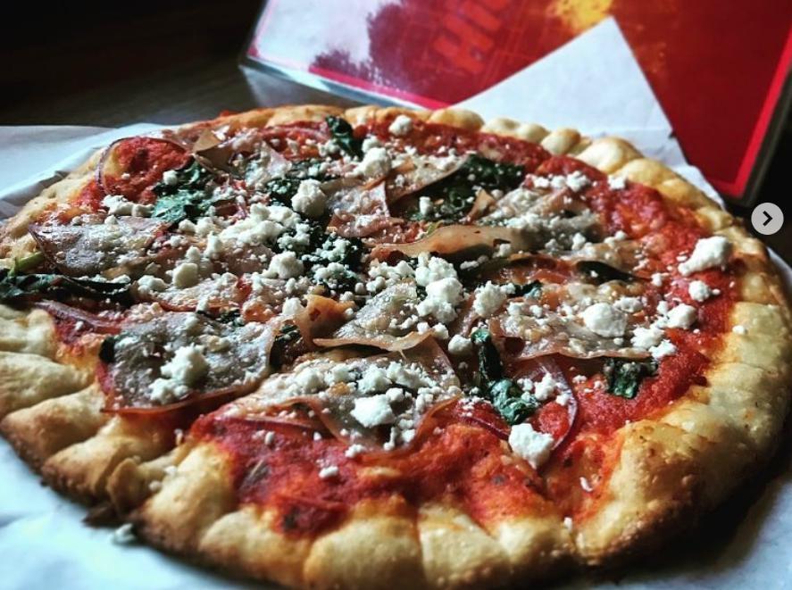 Greek Pizza · Lamb, Kalamata olives, onions, pepperoncinis & feta.
