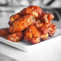 New York Buffalo Chicken Wings · Chicken wings braised in Umai secret sauce and deep fried to a golden perfection and tossed ...