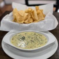 Spinach Dip · Melted jalapeño jack cheese mixed with onion, tomato, green bell peppers, spinach, served wi...
