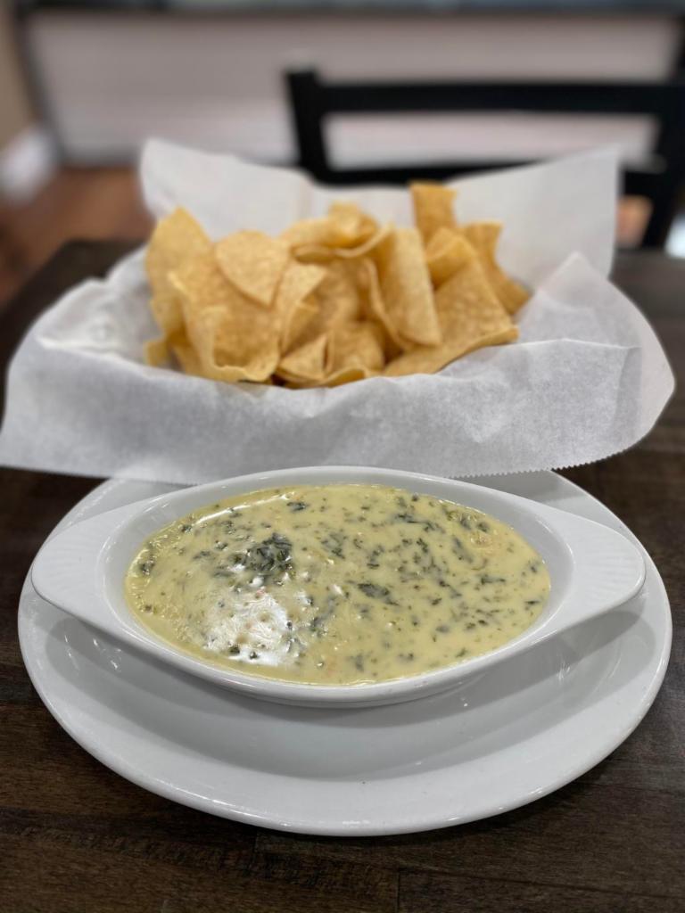 Spinach Dip · Melted jalapeño jack cheese mixed with onion, tomato, green bell peppers, spinach, served with tortilla chips