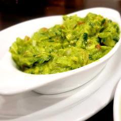 Guacamole Dip · Hand-made guacamole made with fresh avocados, cilantro, tomato, onion, jalapeño, lime juice, served with tortilla chips.