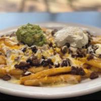 Carne Asada Fries · French fries topped with carne asada, cheese, sour cream, and fresh guacamole
