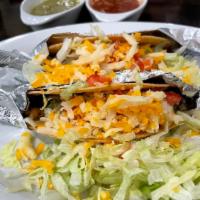 2 Tacos QB · Two crunchy shell or soft (flour or corn) tacos with choice of meat, topped with lettuce, to...