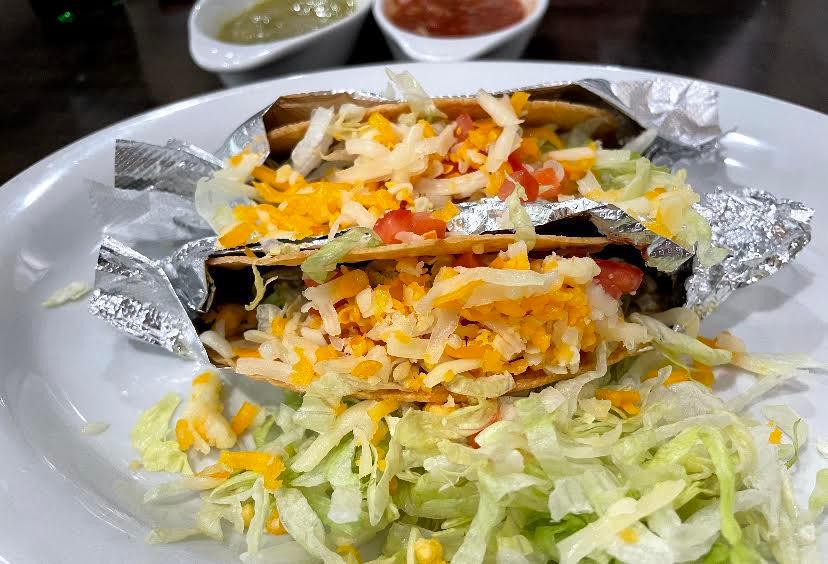 2 Tacos QB · Two crunchy shell or soft (flour or corn) tacos with choice of meat, topped with lettuce, tomato, and cheese  
