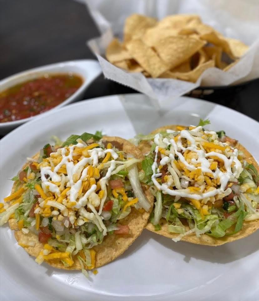 Tostada QB · Tostada with refried beans, choice of meat, topped with lettuce, pico de gallo, sour cream, and cheese