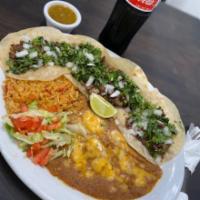 Mexican Street Tacos · Four Mexican street tacos (flour or corn) with choice of meat, topped with onion, cilantro, ...