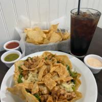Taco Salad Bowl · Crispy shell filled with lettuce, choice of meat, mix of black beans, corn, roasted bell pep...