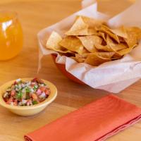 Pico de Gallo and Chips · Fresh salsa. Thinly sliced and crispy.