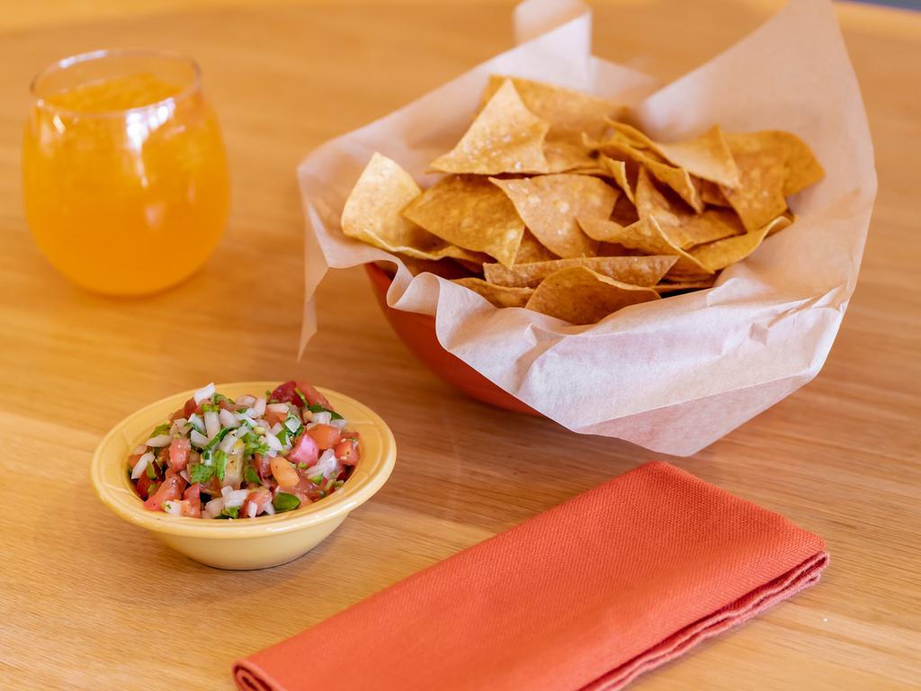 Pico de Gallo and Chips · Fresh salsa. Thinly sliced and crispy.