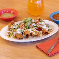 4 Taquitos Dorados · Shredded chicken or carnitas, white cabbage, salsa verde, guacamole, Mexican crema and pico ...