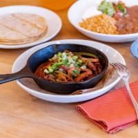 Cha Fajitas · Grilled steak or chicken, onions, corn, peppers, black or pinto beans, Spanish rice, guacamo...