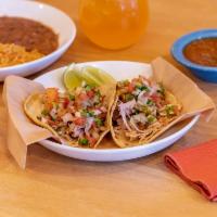 Taco Combo · 2 tacos of your choice, house veggies, meat, fish or prawns. Black or pinto beans, Spanish r...