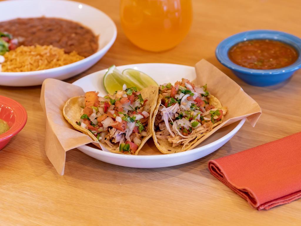 Taco Combo · 2 tacos of your choice, house veggies, meat, fish or prawns. Black or pinto beans, Spanish rice, fresh guacamole, pico de gallo and Mexican crema.
