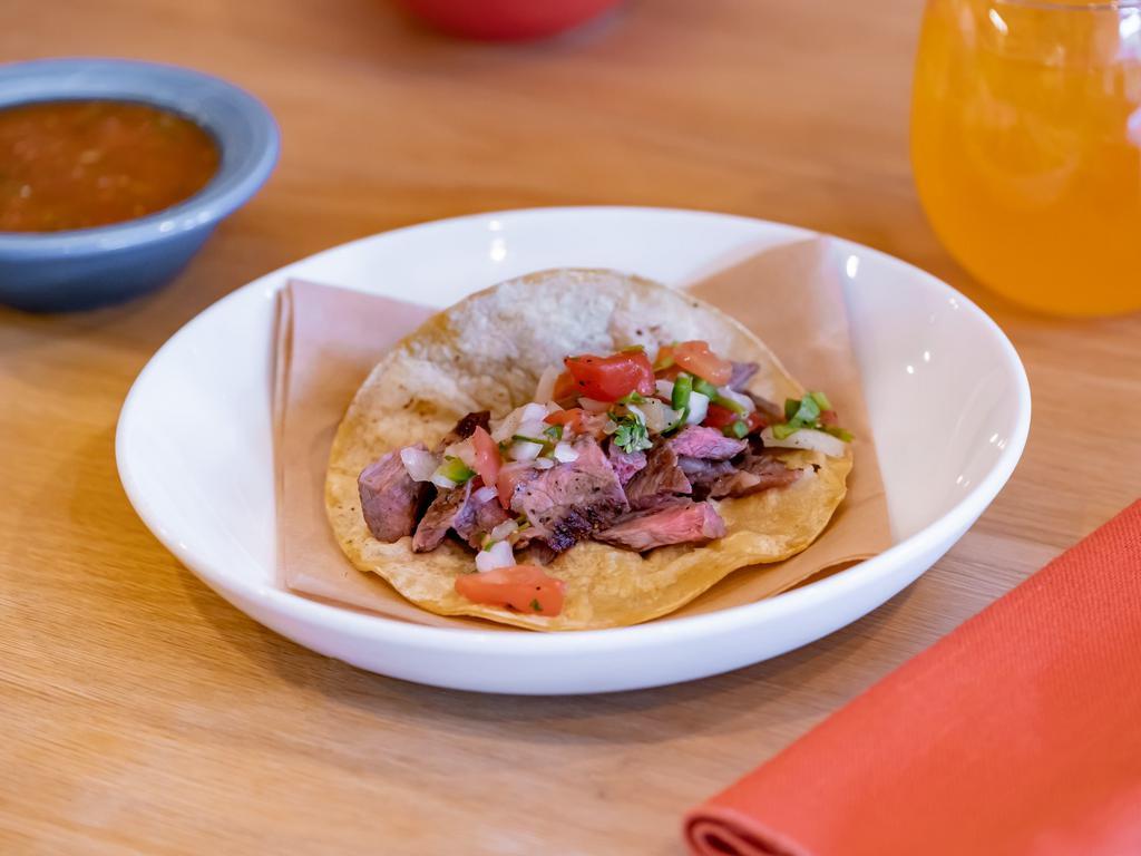 Carne Asada Taco · Grilled painted hills beef topped with chopped cilantro and onions.