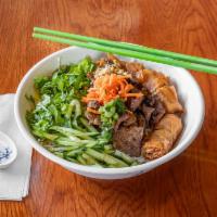 32. Charcoal-Broiled Pork and Egg Rolls Vermicelli · Thirty two is a steamed vermicelli bowl. It is served mixing with bean sprouts, chopped cucu...