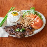 54. Crushed Rice with Shredded Pork Skin, Pork Chop and Fried Egg · It is a steamed, crushed white rice meal with charcoal-broiled pork chop, thinly shredded po...