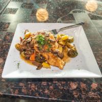 CHICKEN MARSALA · Chicken prepared with a buttery marsala topped with mushrooms served with grilled vegetables...