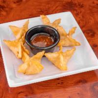 Crab Rangoon · 6 pieces filled with crab, shrimp, and cream cheese.