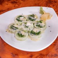 Iron Man Roll · Low carb. Spinach, avocado and cream cheese wrapped in cucumber layers and drizzled with ses...