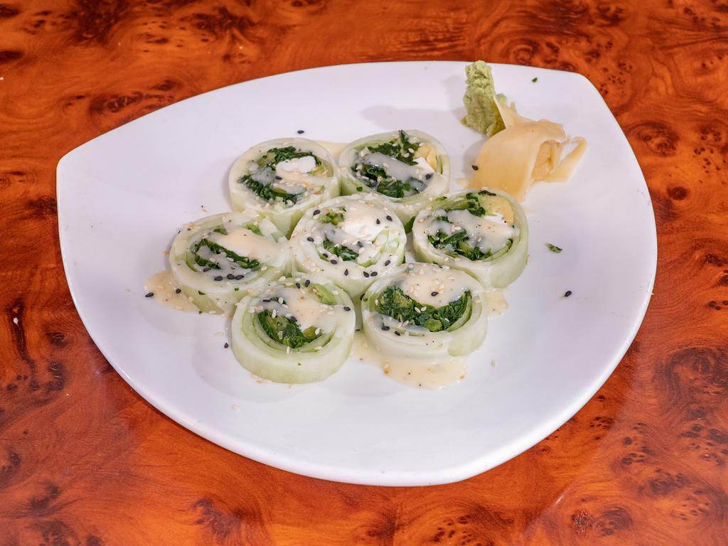 Iron Man Roll · Low carb. Spinach, avocado and cream cheese wrapped in cucumber layers and drizzled with sesame sauce.