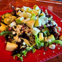 Apple, Nut and Blue Salad · Field greens, Granny Smith apples, candied walnuts, thinly shaved red onion, English
cucumbe...