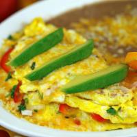 Fiesta Omelette Breakfast · 3 egg omelette with diced ham, diced onions, bell peppers, melted cheese and avocado slices.