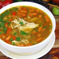 Maria’s Chicken Soup · Shredded chicken with diced tomatoes, onions, cilantro, rice and a lemon wedge.