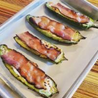 Jalapeno Poppers (4) · Jalapenos filled with red pepper cream cheese, topped with smoked bacon