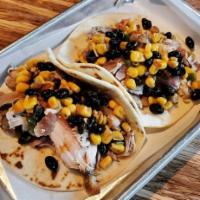 TWO Chicken Tacos · Hand-pulled chicken tacos topped with our homemade black bean and corn chimichurri salsa. 