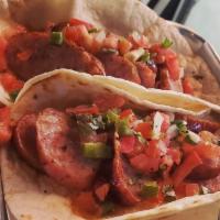 TWO Smoked Sausage Tacos · Our caramelized onion-brat topped with pico de gallo 