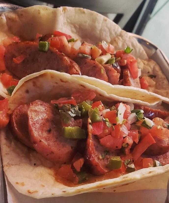 TWO Smoked Sausage Tacos · Our caramelized onion-brat topped with pico de gallo 