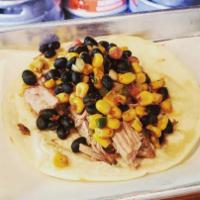 Chicken Taco · Hand-pulled chicken tacos topped with our homemade black bean and corn chimichurri salsa. 