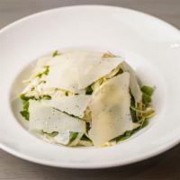 Carciofi Insalata · Thinly Sliced Artichoke, Shaved Parmesan Cheese and Baby Baby Arugula.